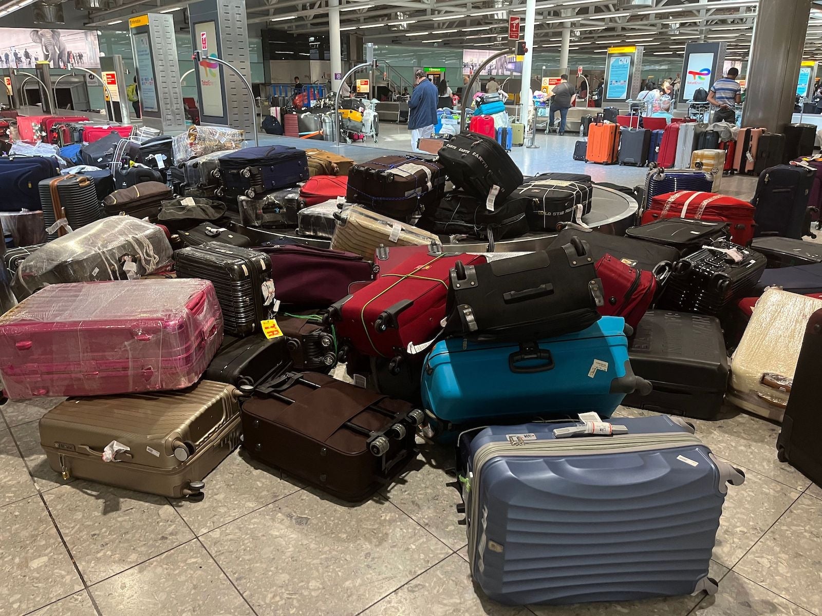 suitcase pile at heathow