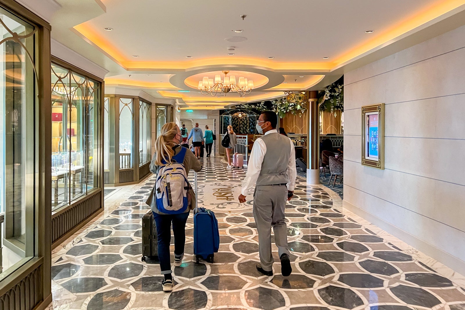 Concierge staff escorting passengers off the ship