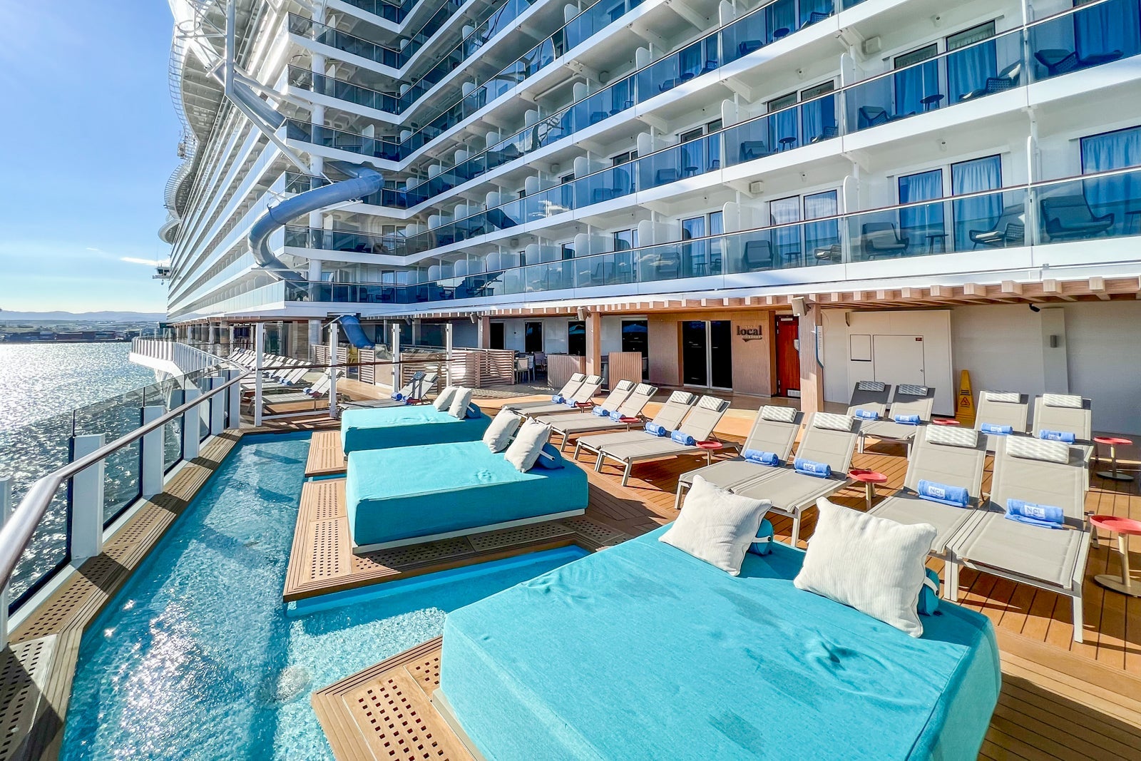 Sun deck overlooked by cabins on Norwegian Prima cruise ship