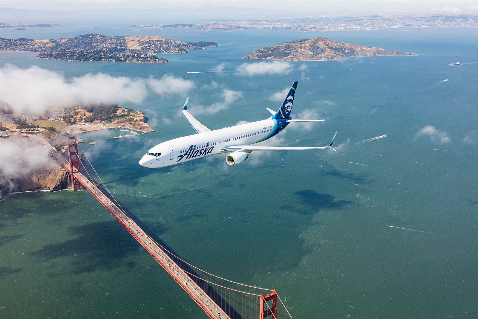 Alaska plane flying over Golden Gate bridge