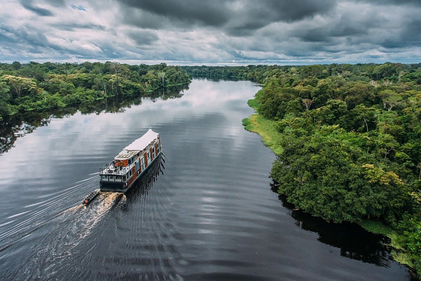 An Aqua Expeditions vessel sailing in the Peruvian Amazon 