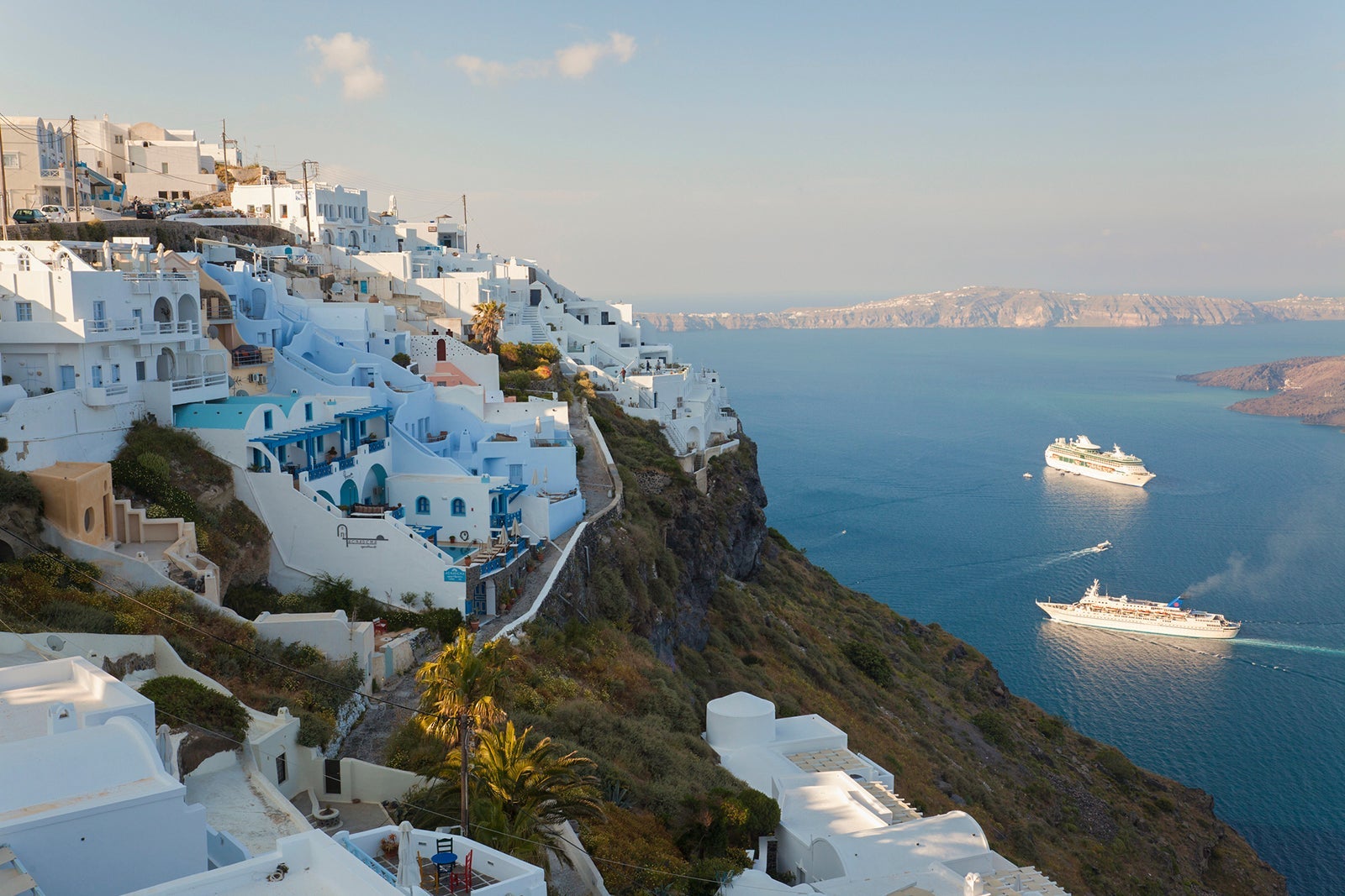Cruise ships sail off Fira in Santorini