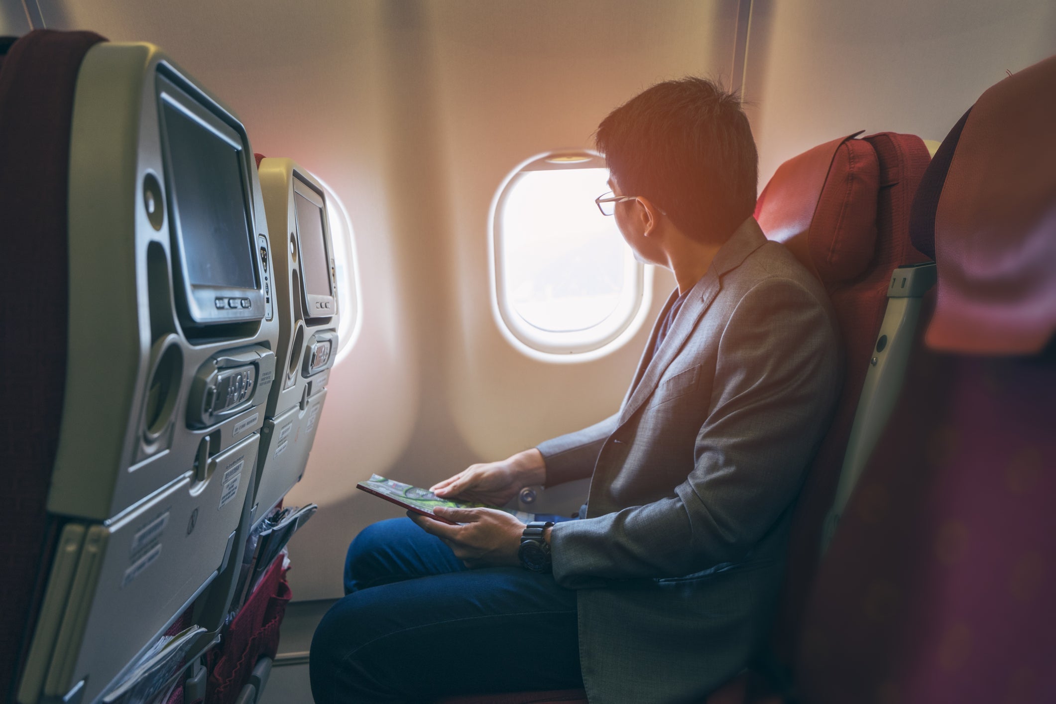 man on plane wearing a suit