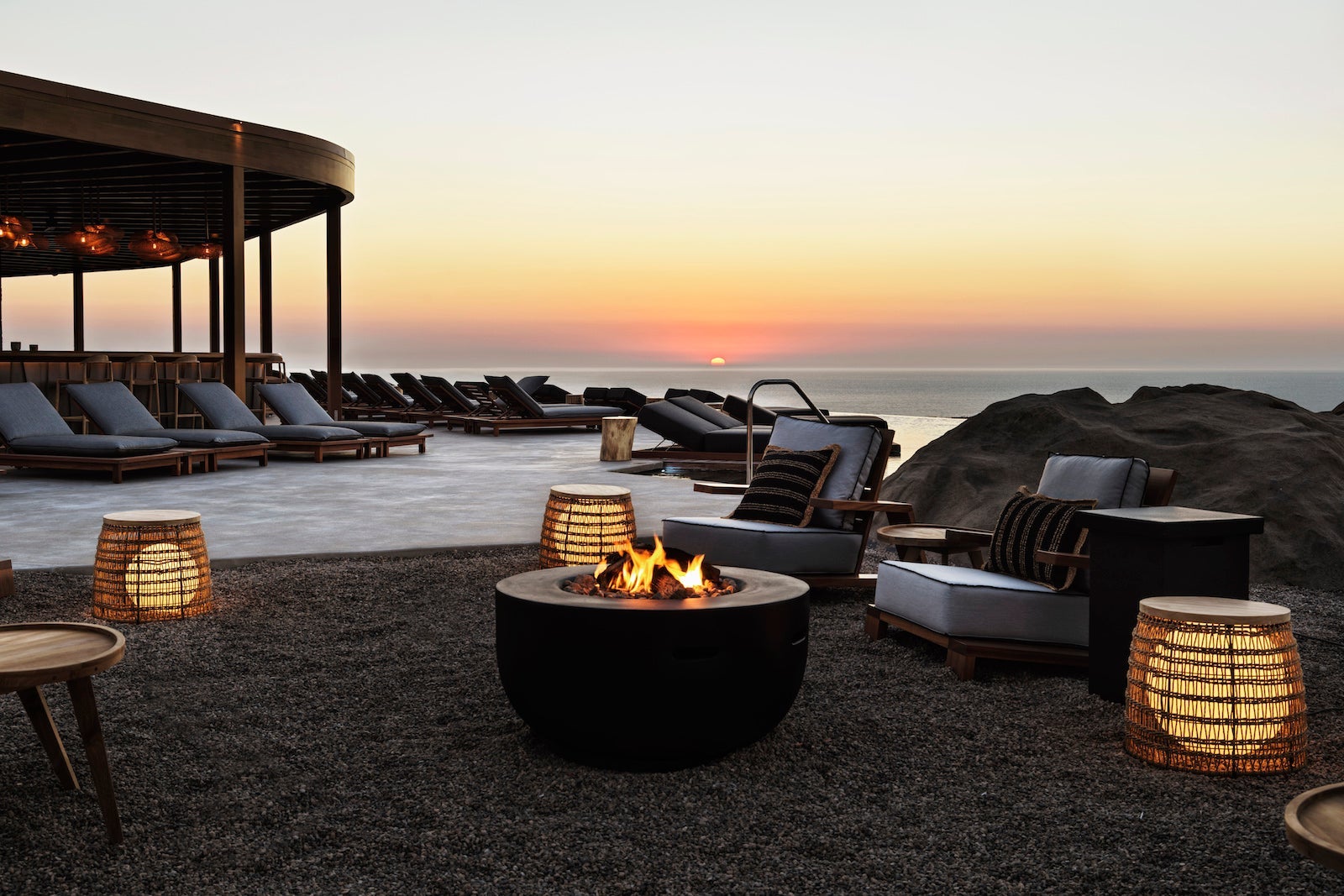 Firepit near pool overlooking ocean