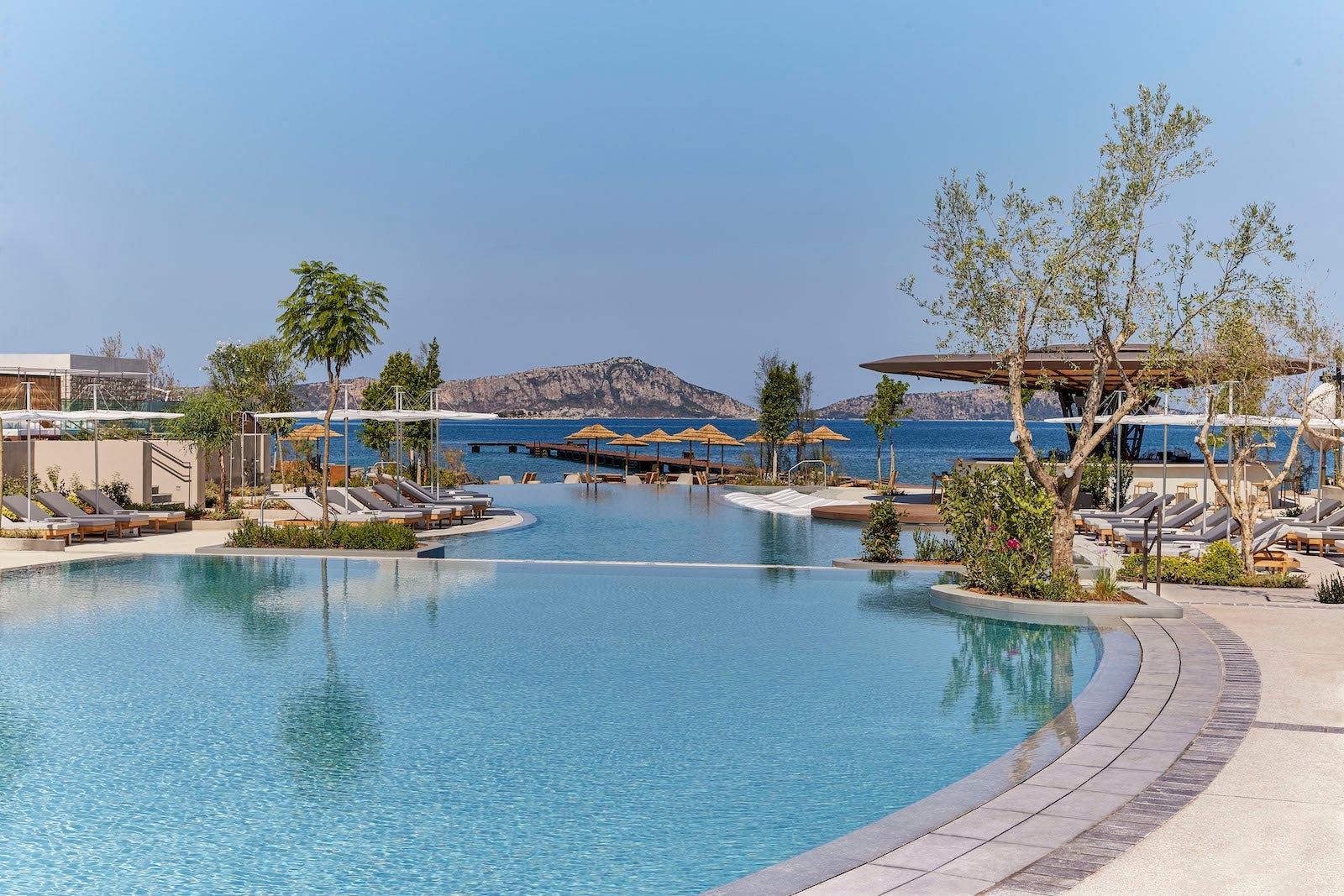 infinity pool overlooking ocean and island in the distance