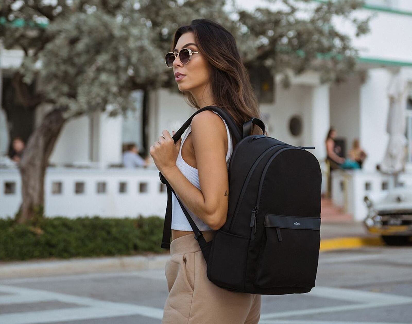 Woman carrying Arlo Skye backpack