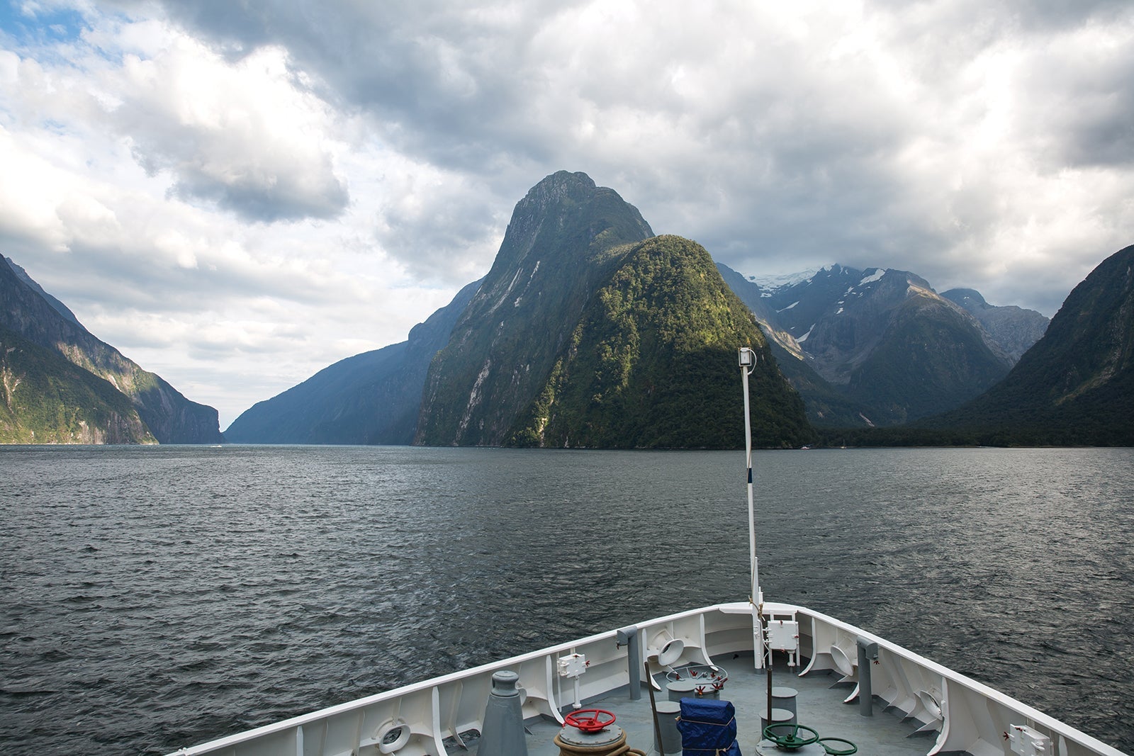 The bow of a cruise ship headed into Fiordland National park in New Zealand