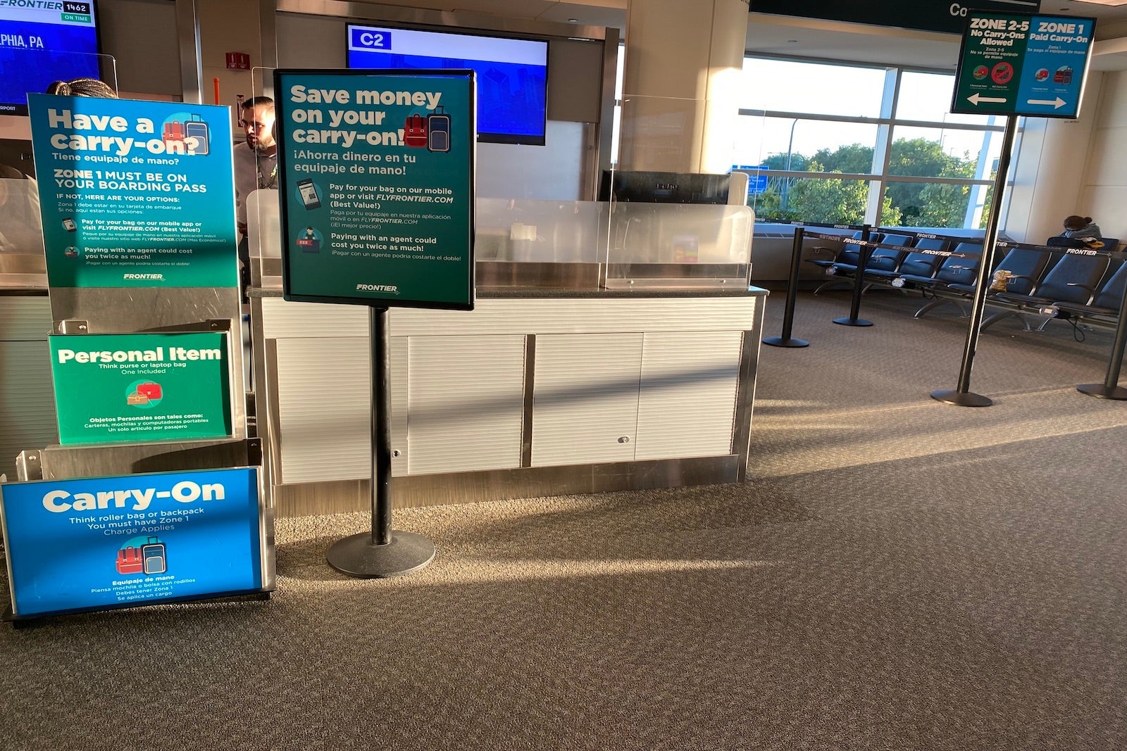 signage about checked bags and boarding groups