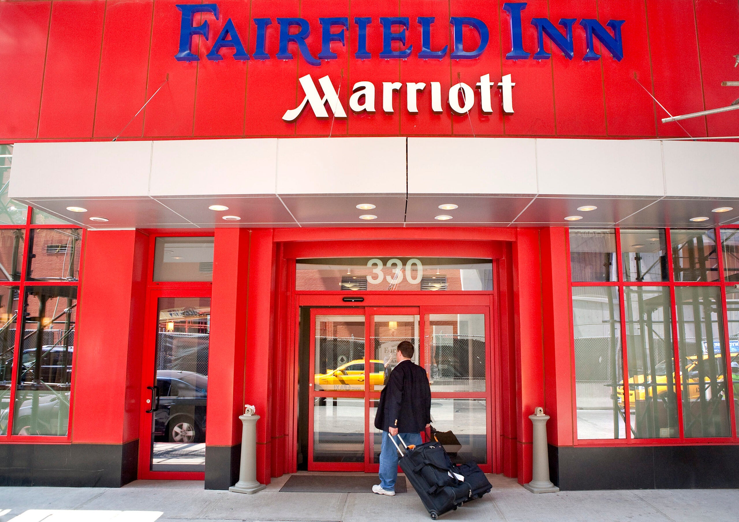 A traveler enters a Fairfield Inn in New York City