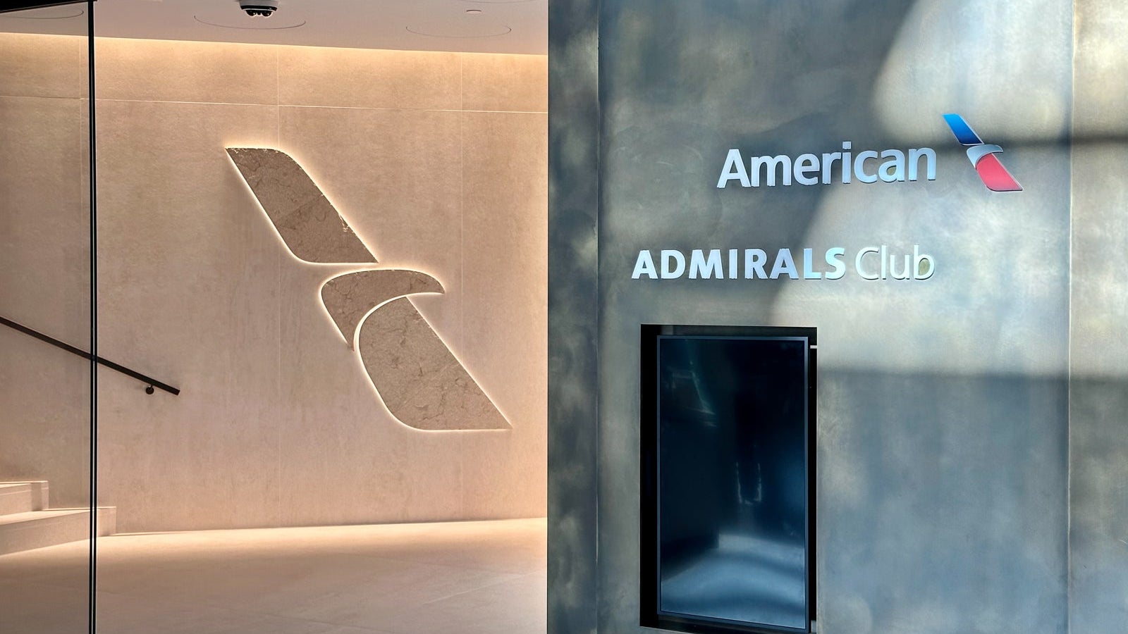 An American Airlines Admirals Club lounge entrance, illustrating the Admirals Club membership price increase 2026. AI