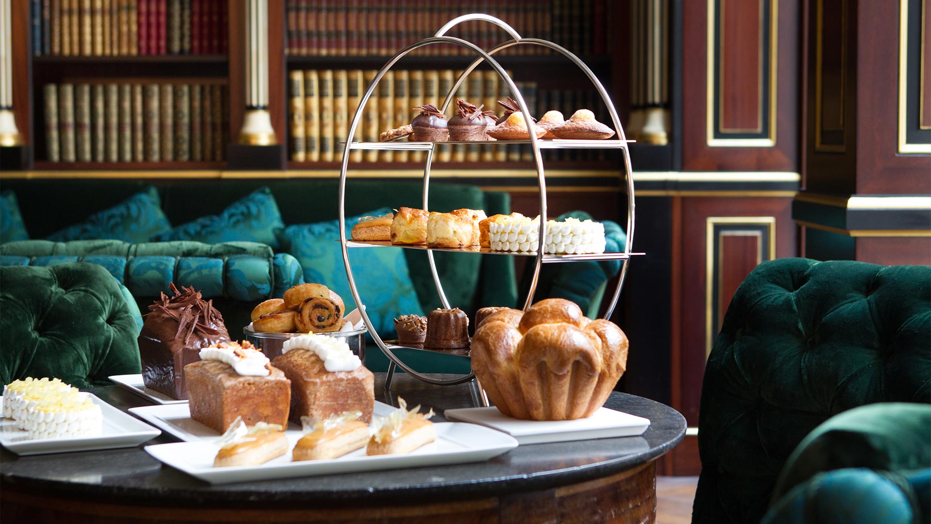 A photo of pastries in the library or sitting area at La Reserve Paris Hotel and Spa.