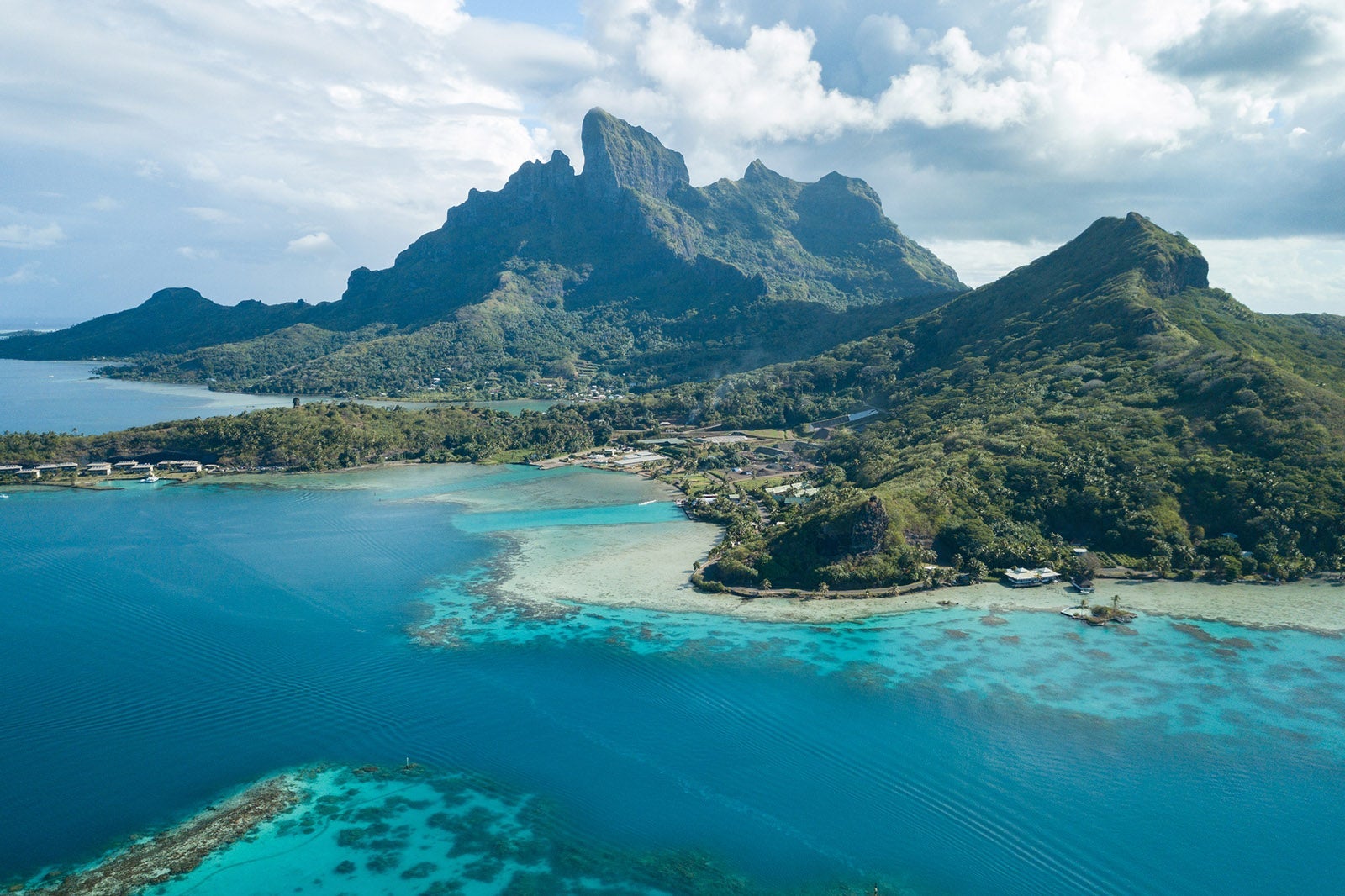 Aerial image from a drone of blue lagoon and Otemanu mountain at Bora Bora island, Tahiti, French Polynesia, South Pacific Ocean (Bora Bora Aerial)