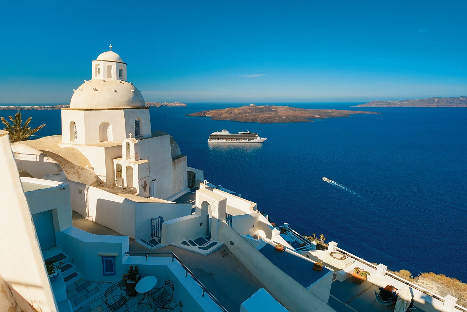 The Oceania Cruises ship Vista anchored off the coast of Santorini.