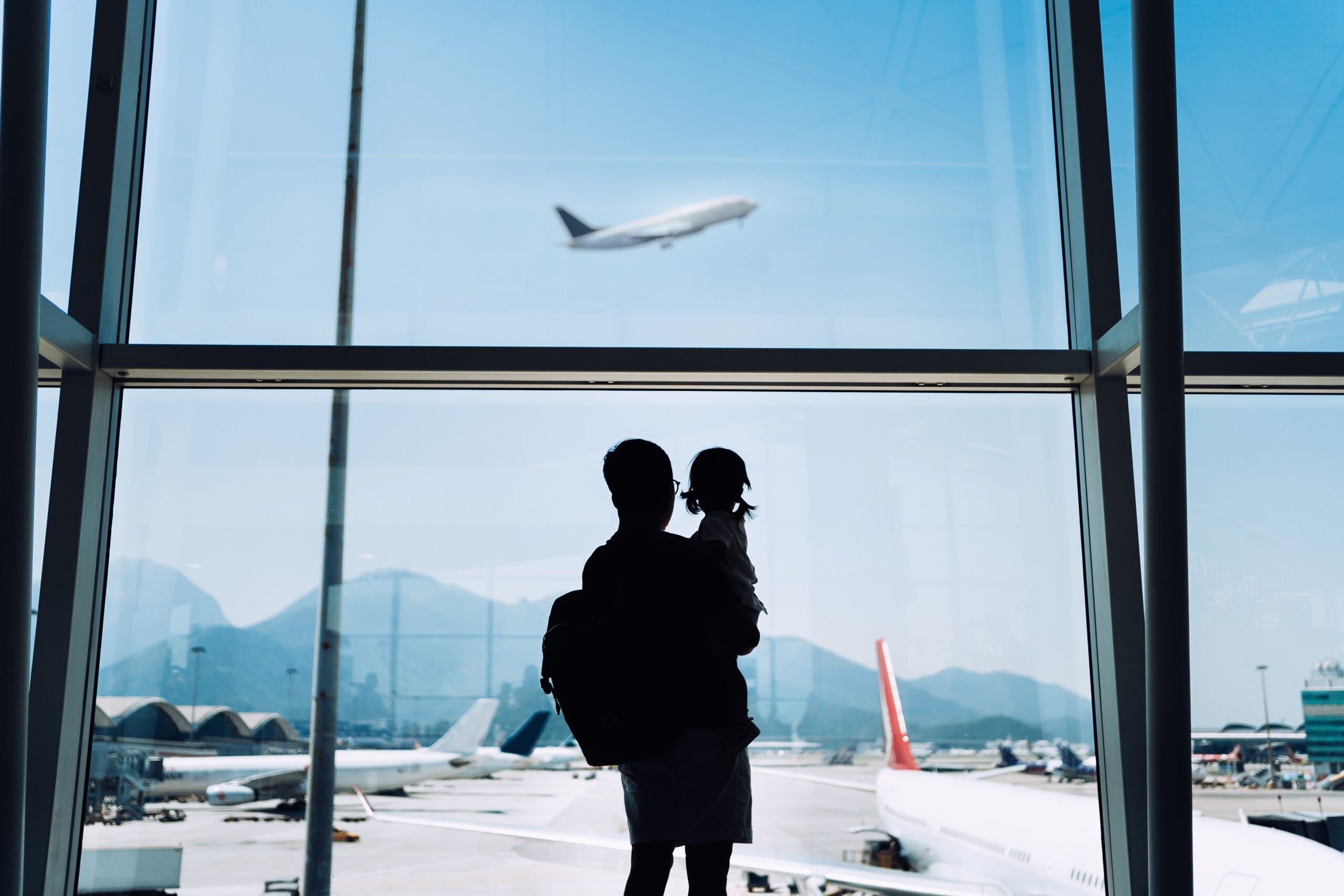 Father and daughter at an airport