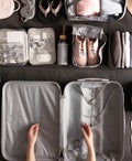 Woman Packing Suitcase For Travelling