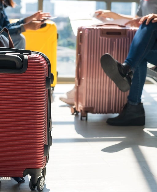 Three suitcases at an airport