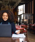 Restaurant owner using laptop