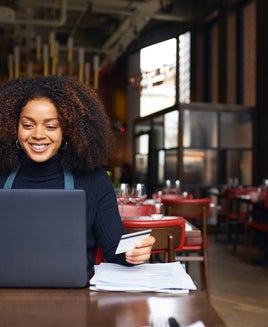 Restaurant owner using laptop