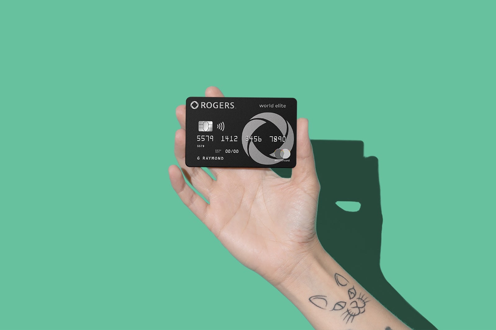 a hand holds one of the best travel credit cards in Canada