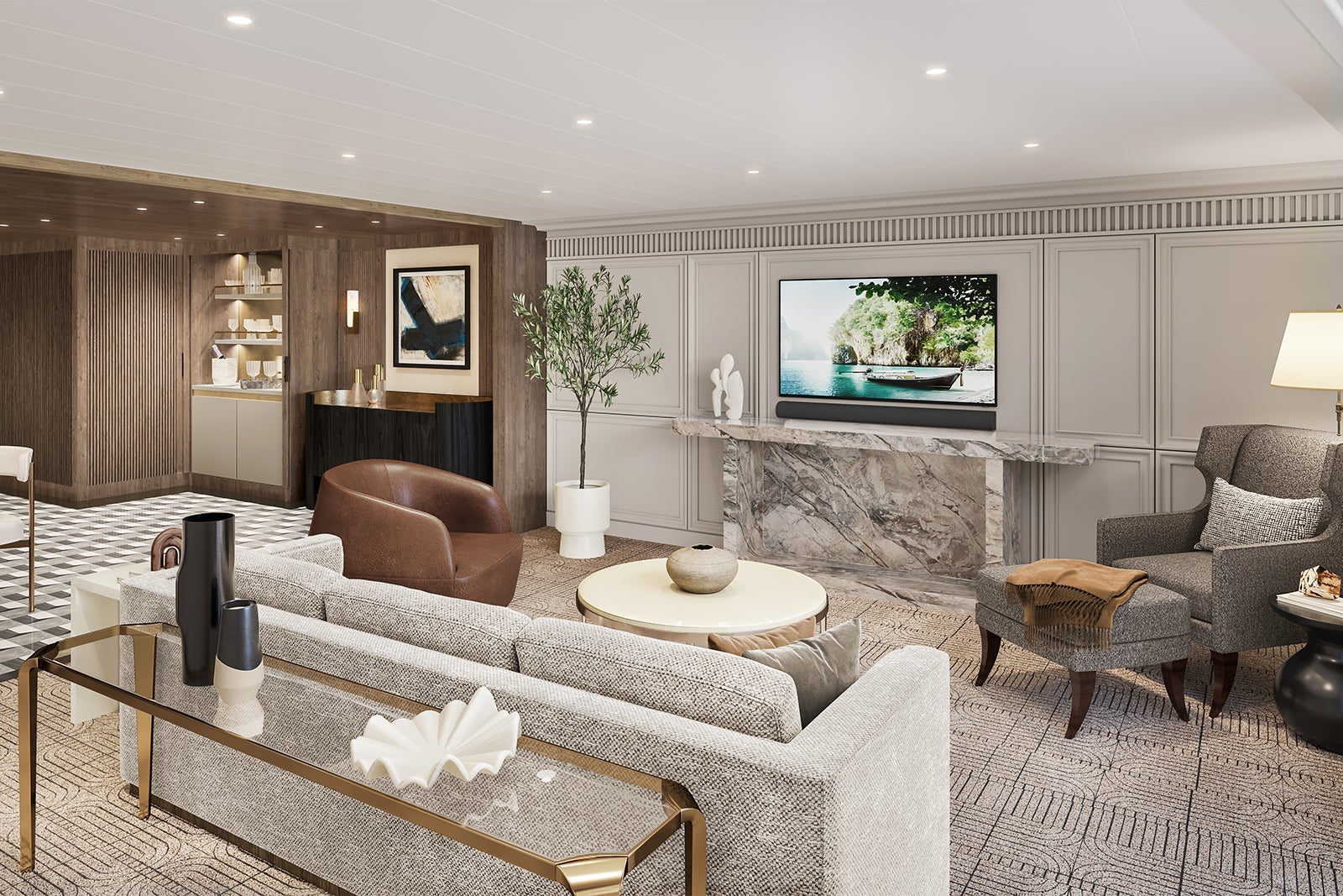 Vista Suite living room with couch, TV and bar on Riviera cruise ship