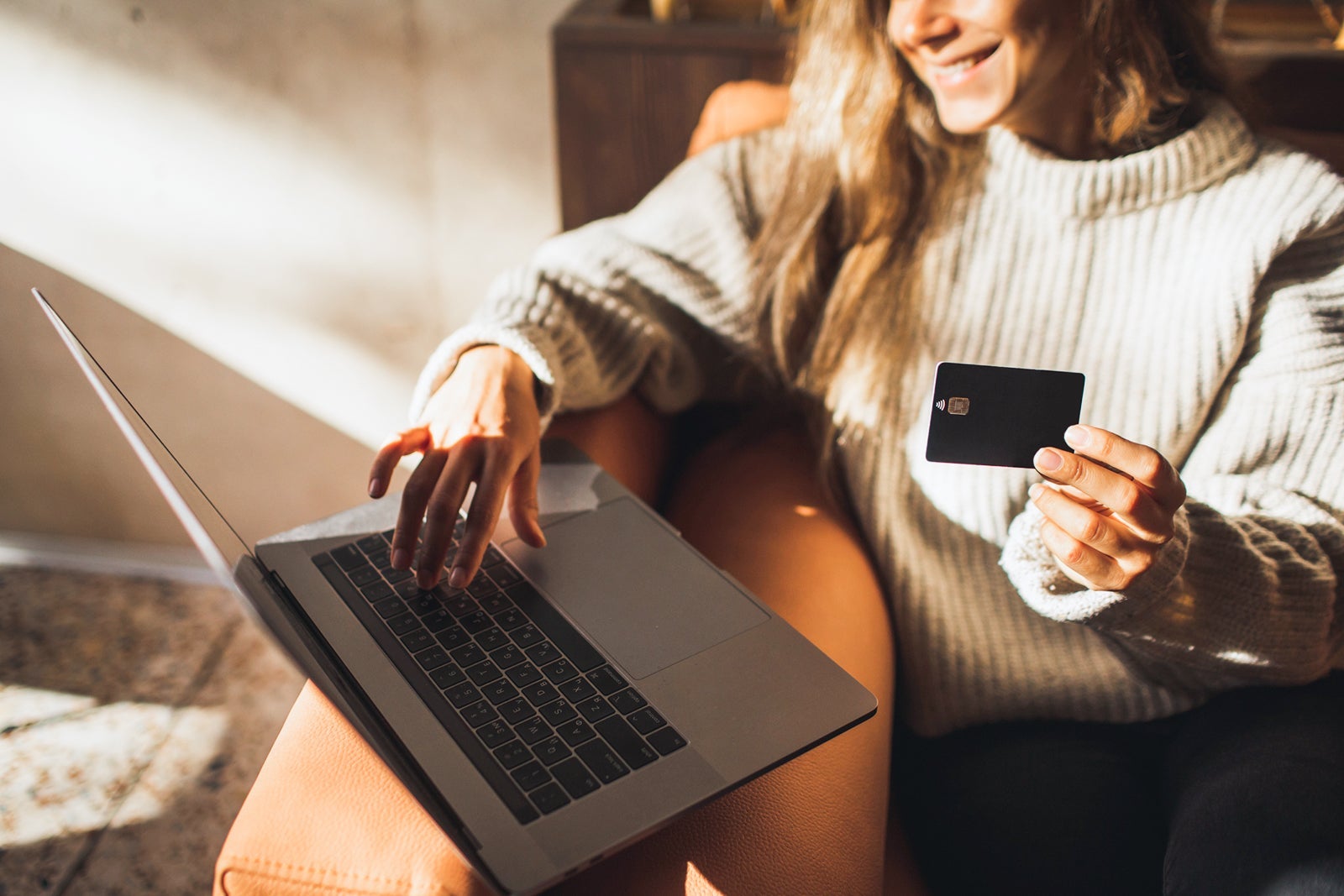 woman at computer with credit card