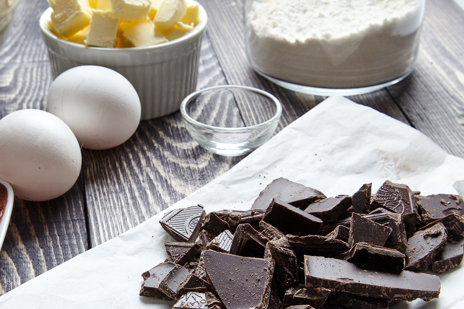 Cake ingredients including butter, flour, eggs, chocolate