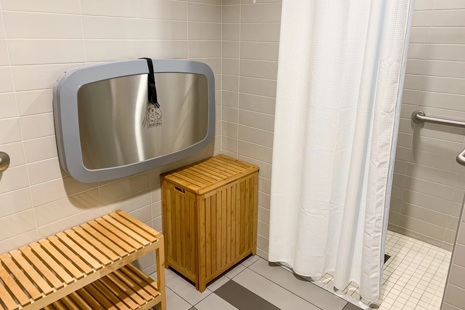a shower room inside an airport lounge bathroom