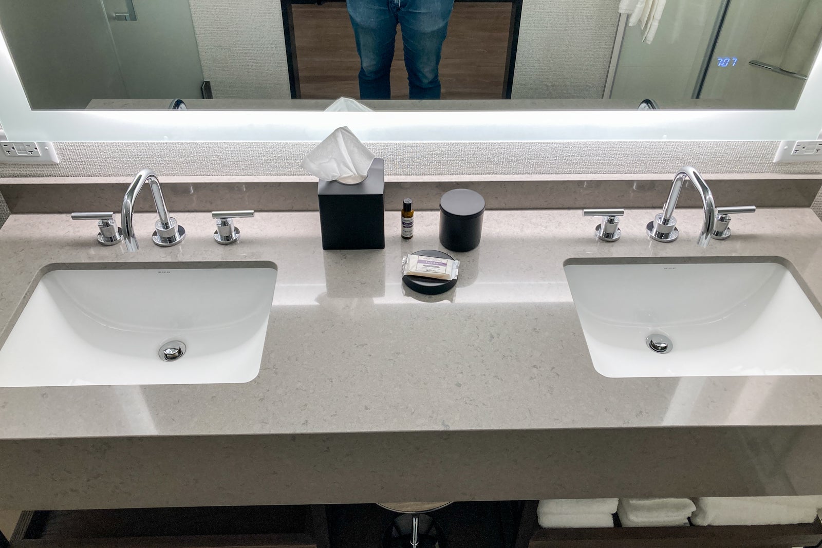 looking down at dual sinks with a mirror behind them