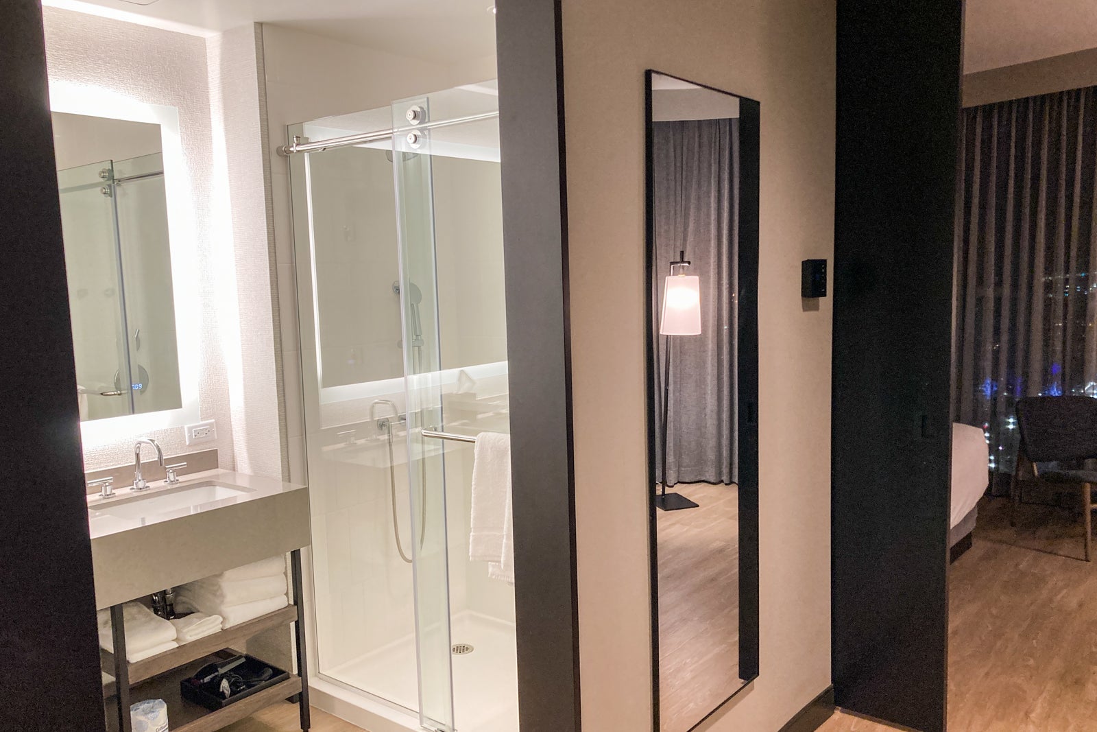 the hallway and entrance to the bathroom in a hotel suite