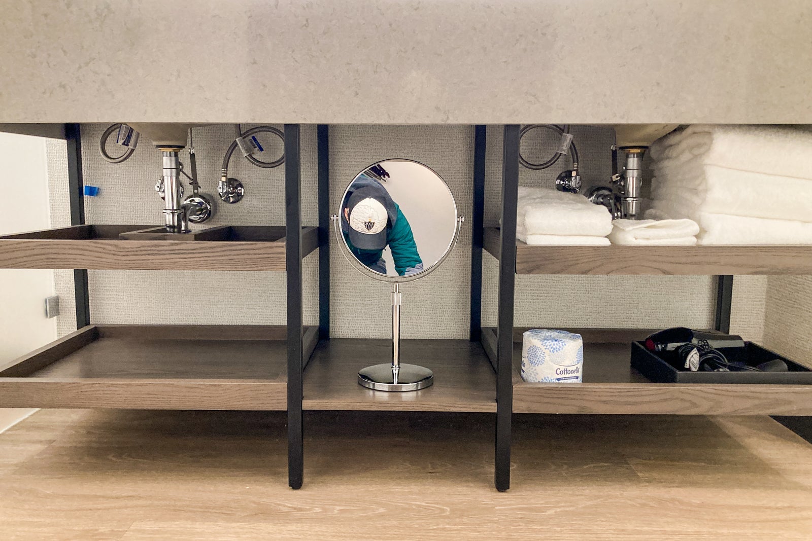 shelves under a hotel sink
