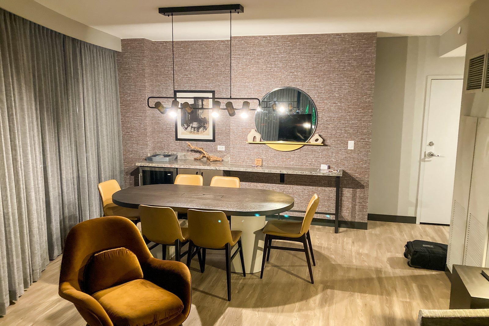 a six-person table in a hotel suite's living room