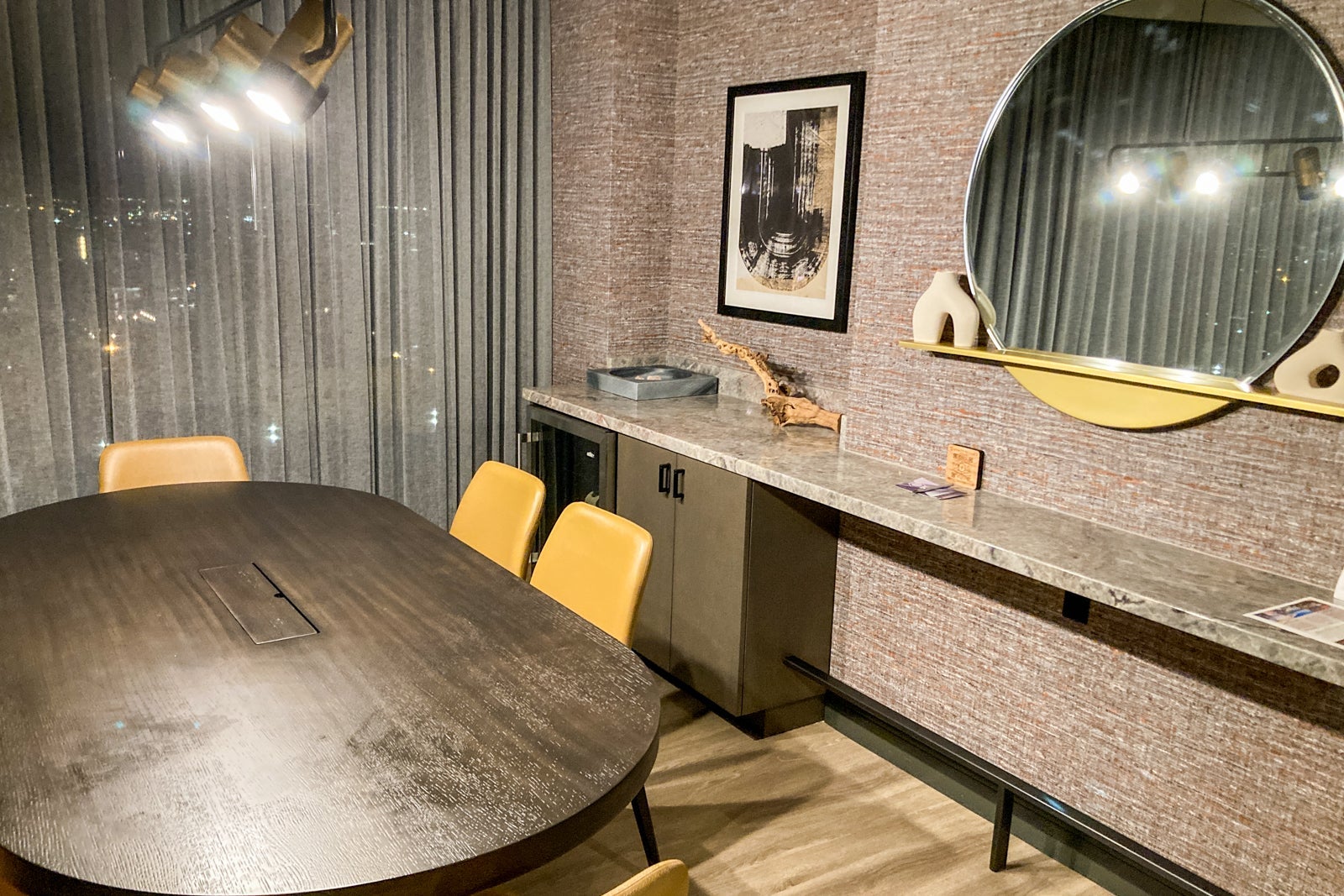 chairs and a counter in a hotel suite's living room