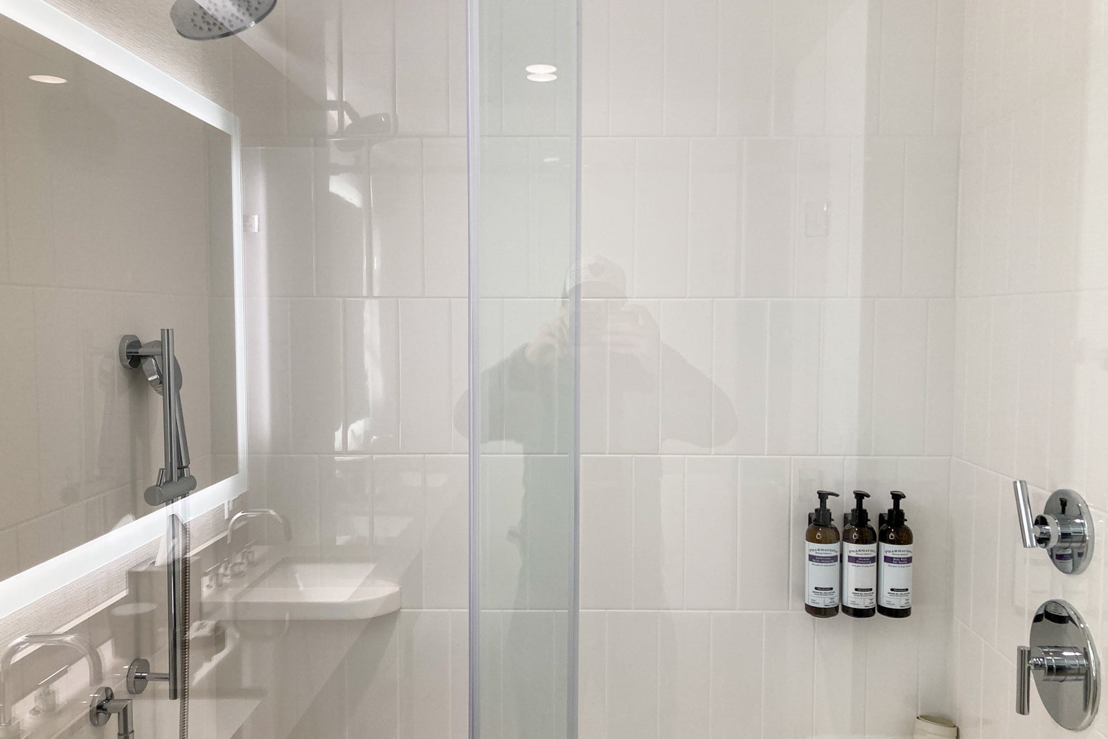a glass shower box in a hotel as seen from the outside