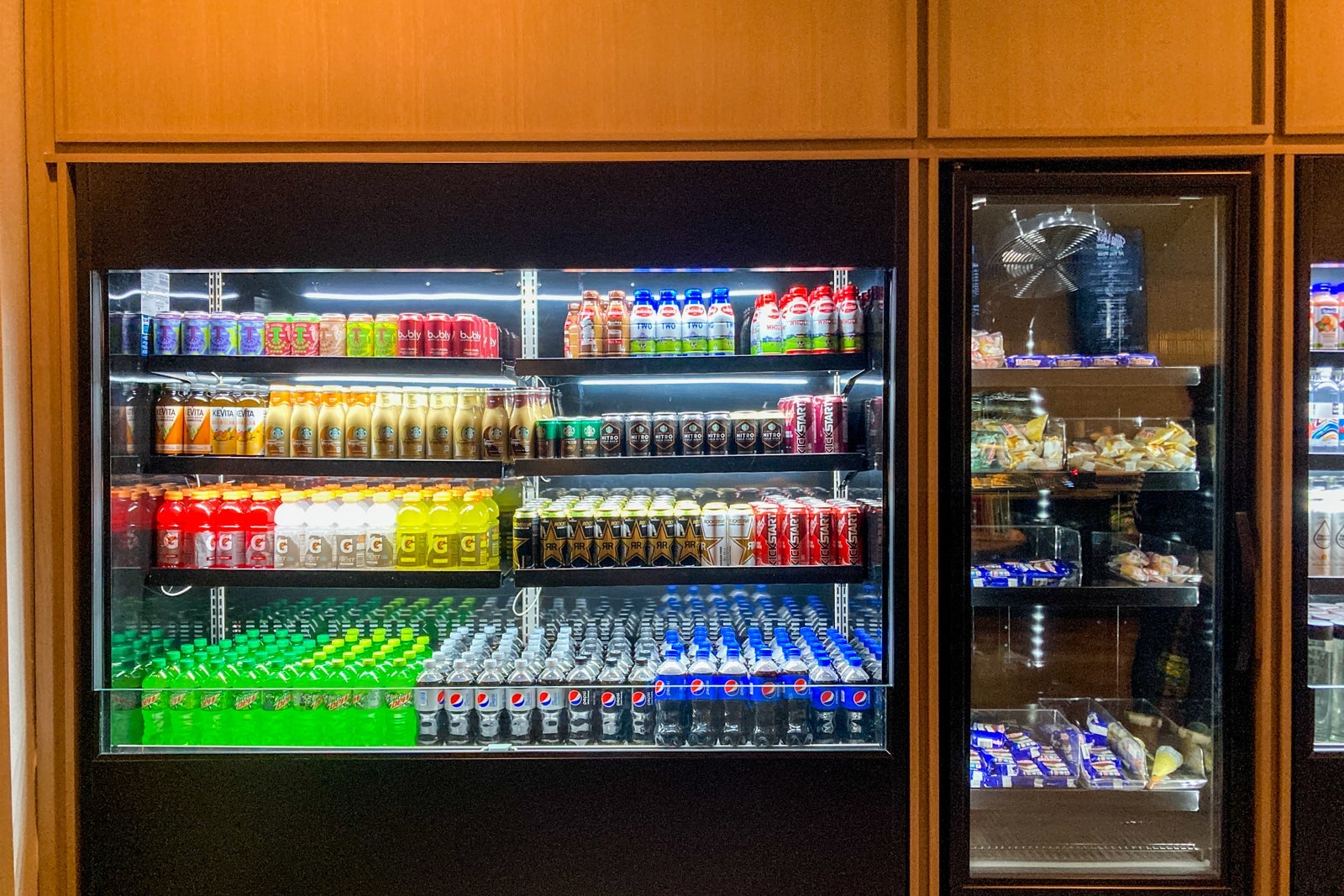 coolers with drinks and snacks at the marketplace near the lobby