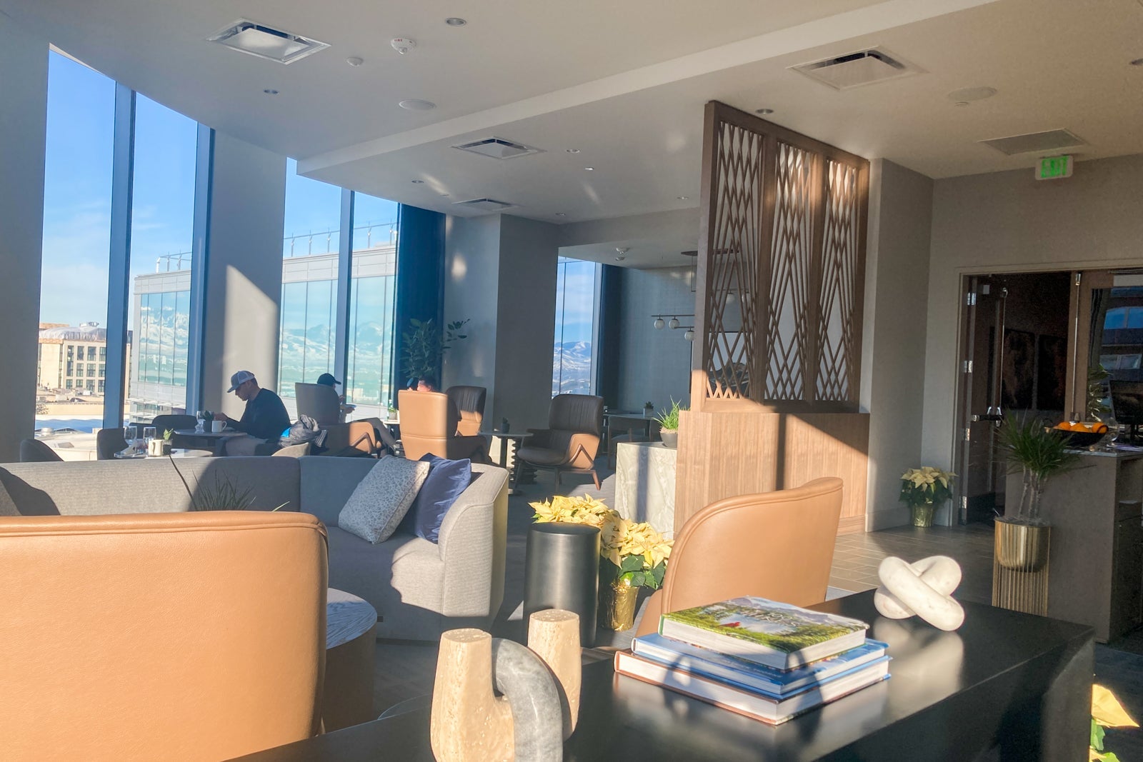 a sun-soaked lounge for those with elite status at a hotel