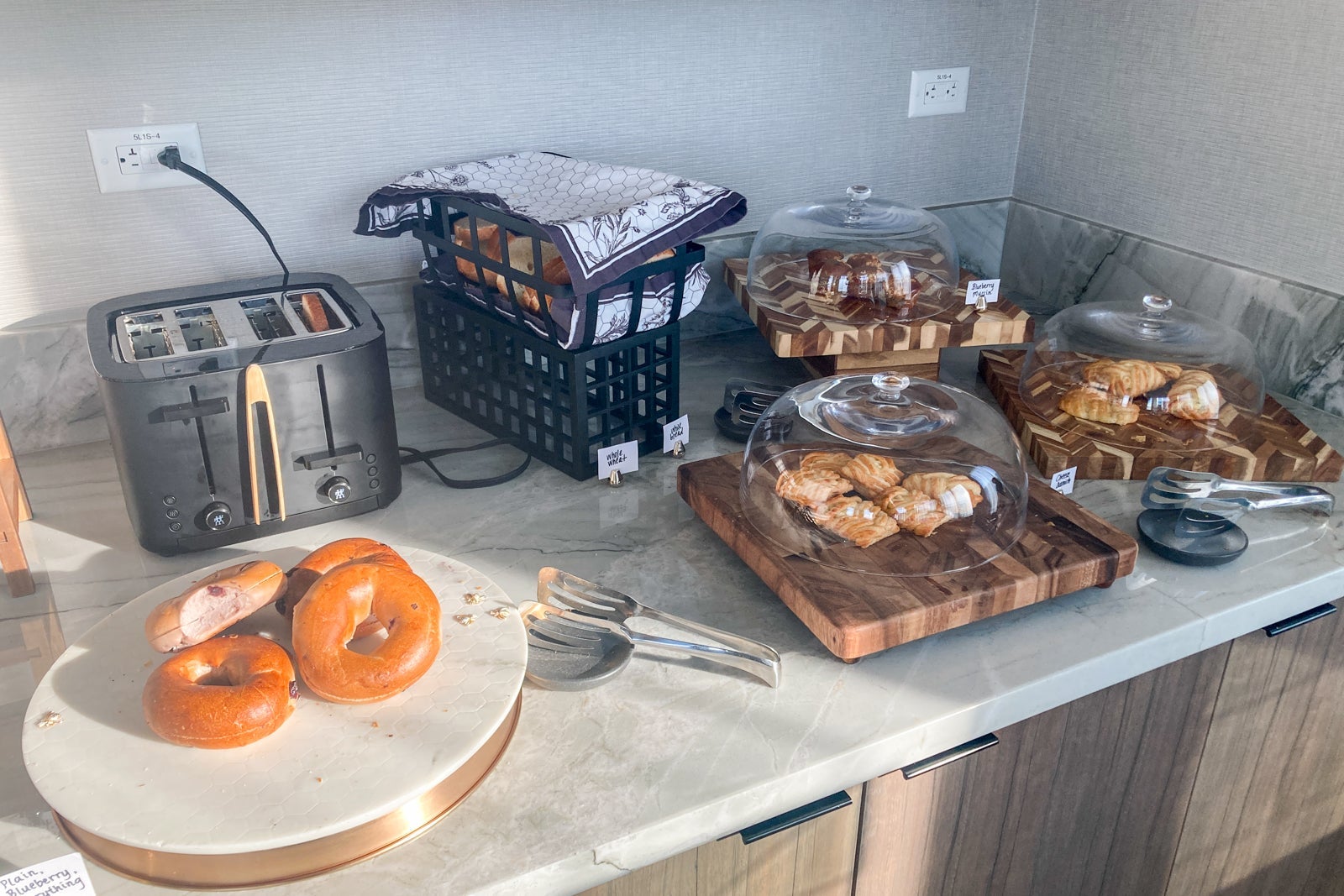 bread items on a breakfast buffet in a lounge for elite status members