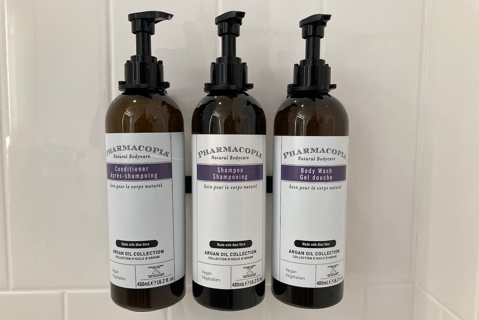 a close-up of shampoo, conditioner and bath gel bottles