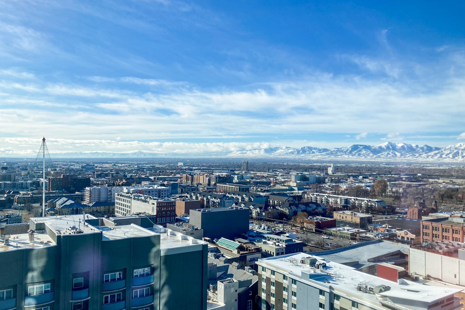 daytime views over a city with mountains beyond