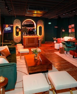 seating and dim lighting inside a pop-up lounge