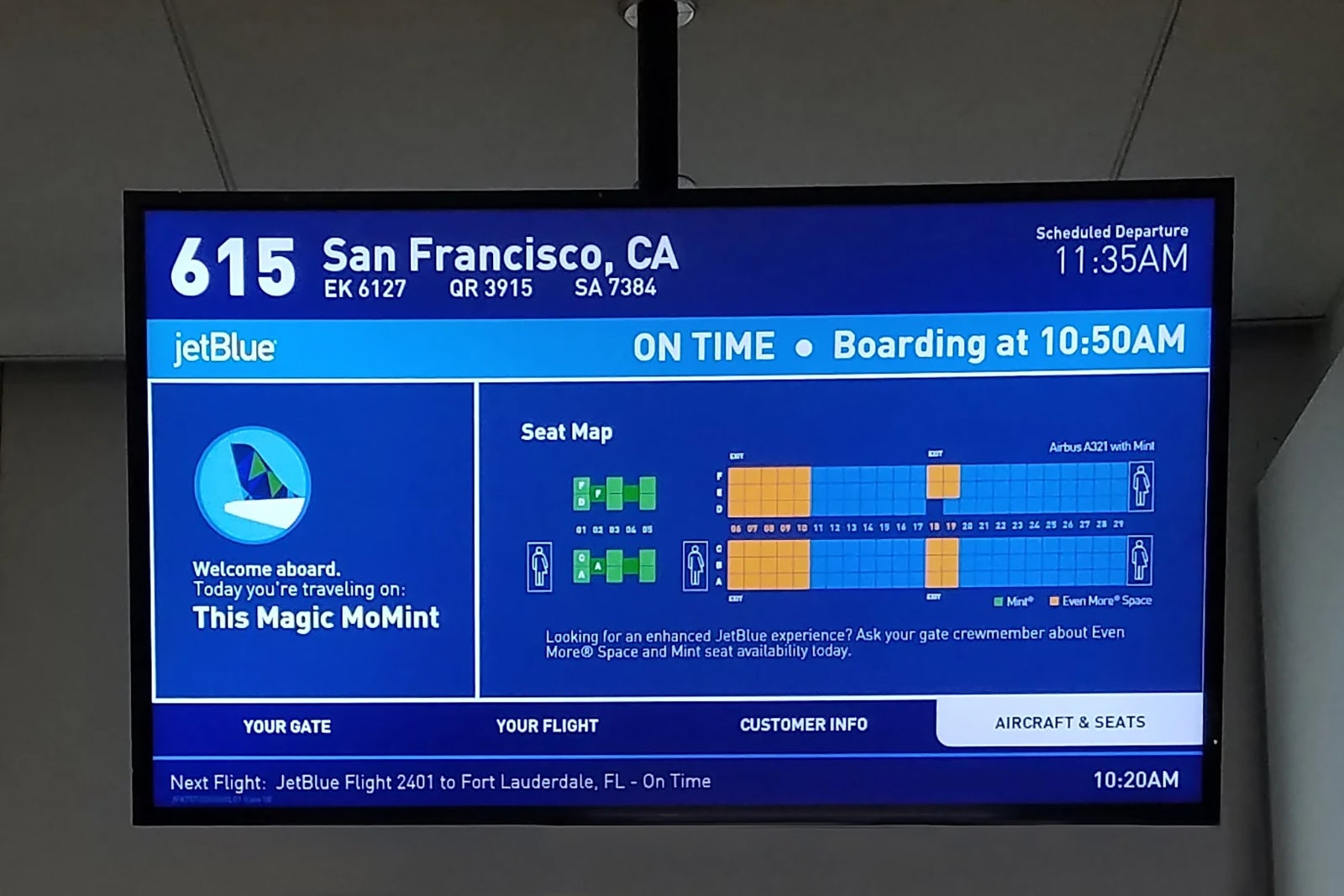 monitor shows flight information for a JetBlue departure