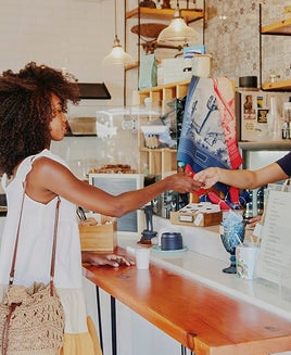 Woman buying coffee