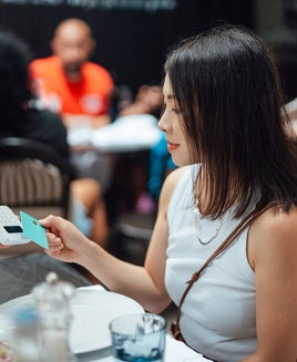 Woman paying for her meal with a credit card