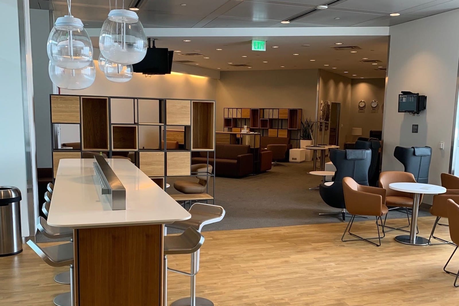 an open entryway near a bar at an airport lounge