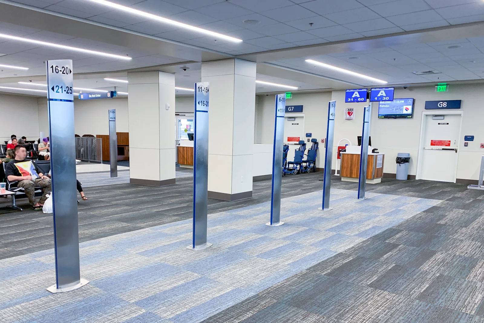 Sign posts with numbers for Southwest Airlines boarding priority