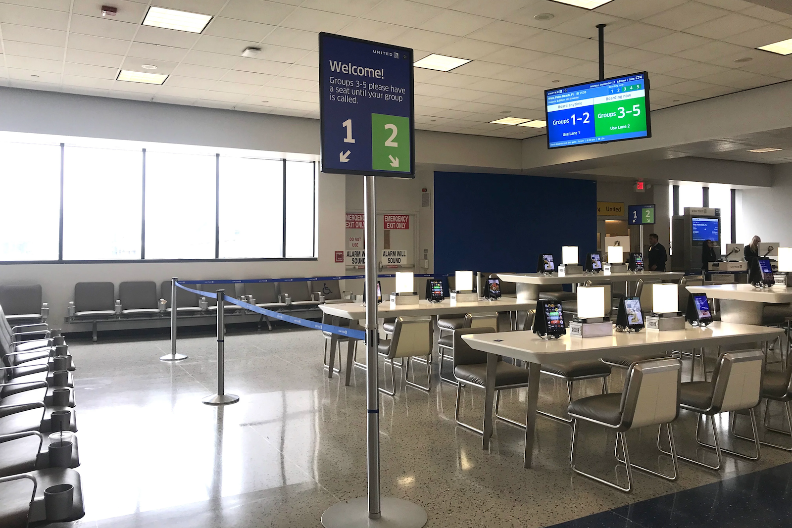 Signs for United Airlines boarding groups before a flight