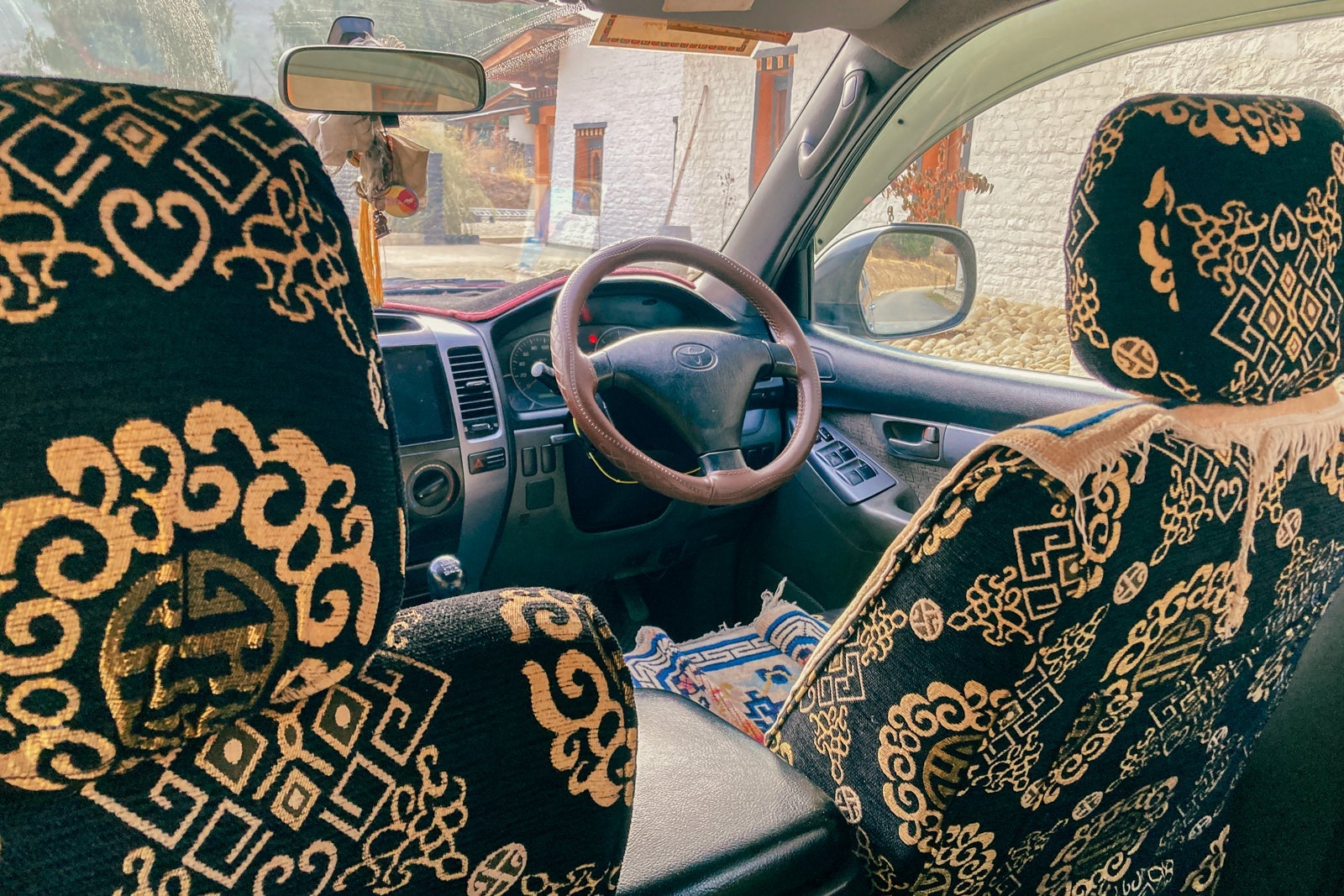 intricate patterns on seat covers inside a car