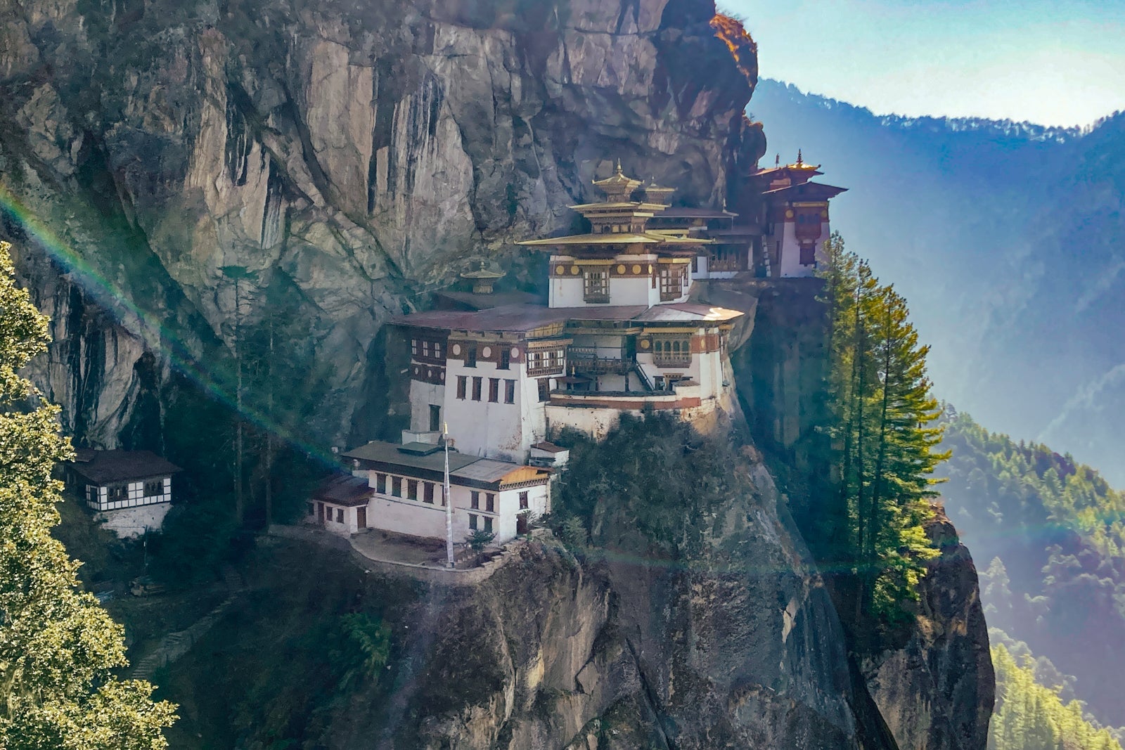 a view of Paro Taktsang, the Tiger's Next, which is a monastery built into the side of a mountain in Bhutan