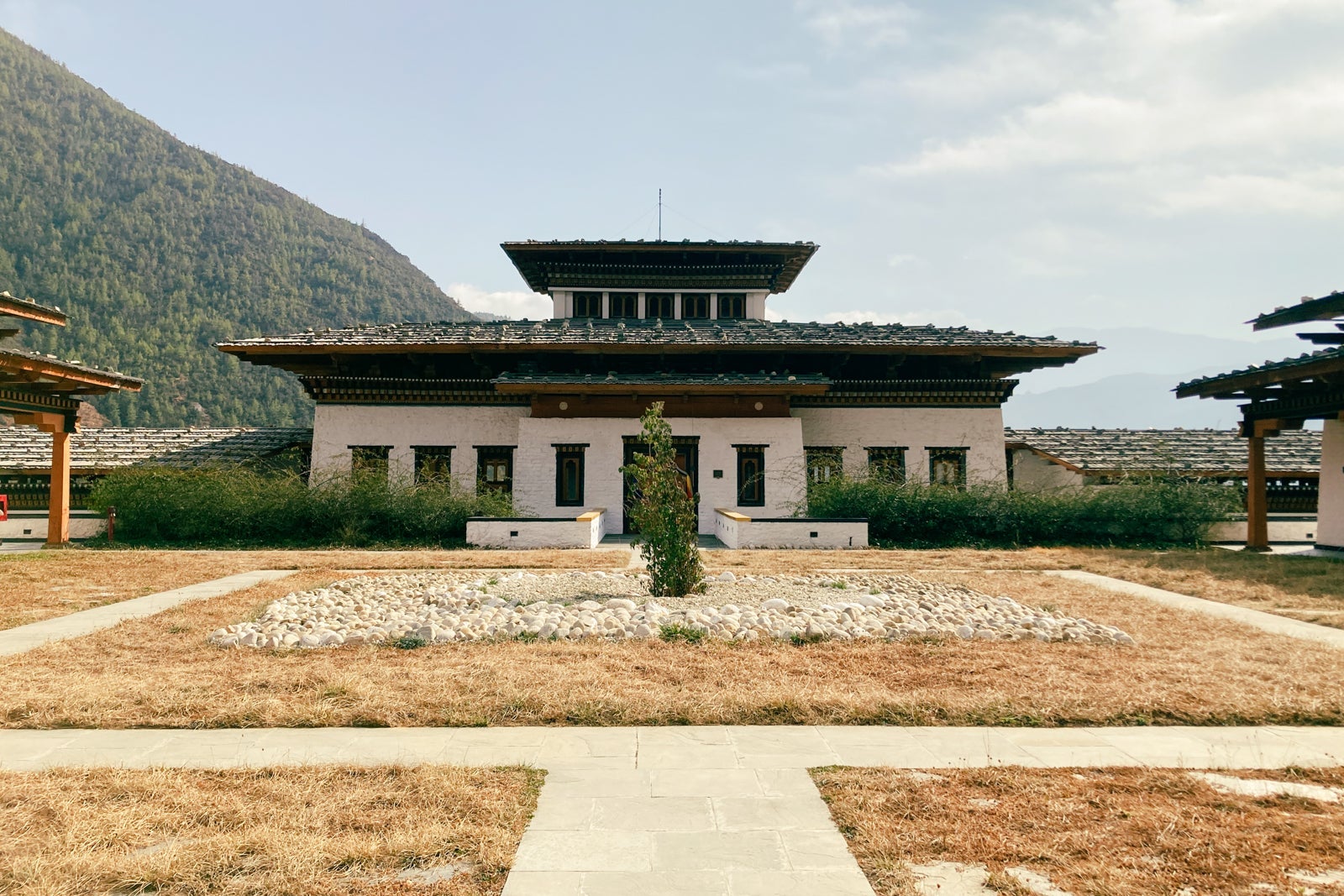 the courtyard leading up to a traditional Himalayan-style building, which has a luxury hotel inside