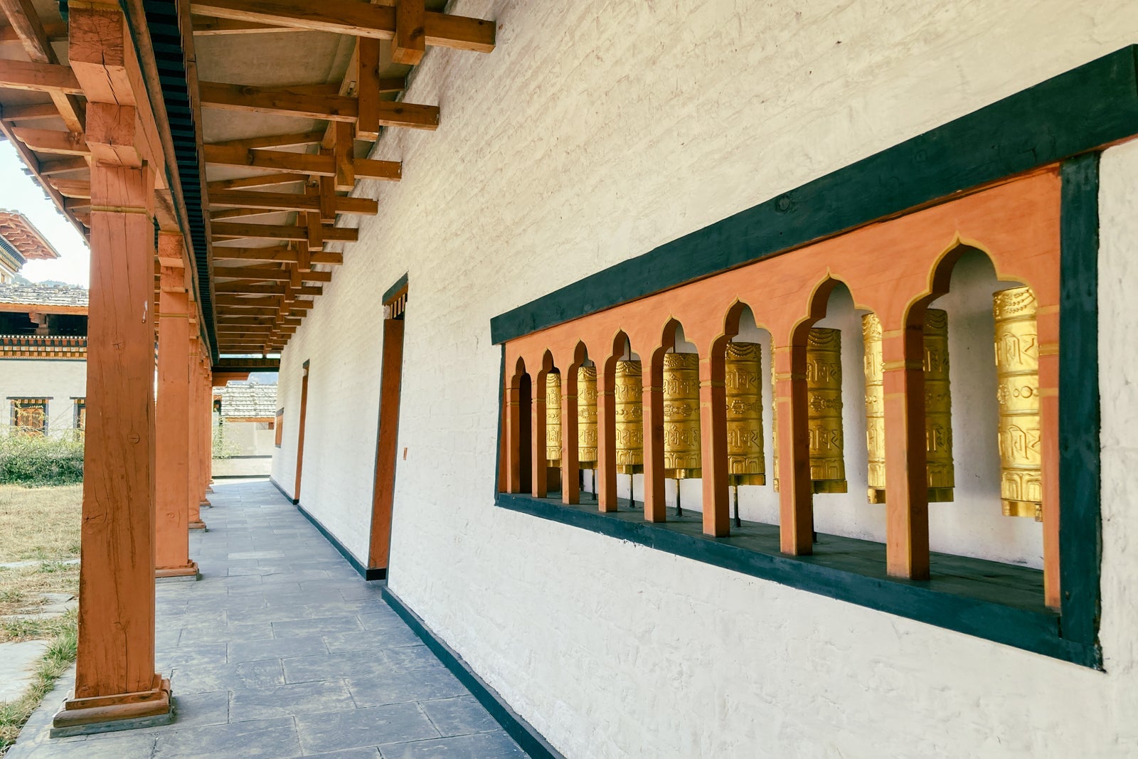 mantra prayer wheels are built into the wall