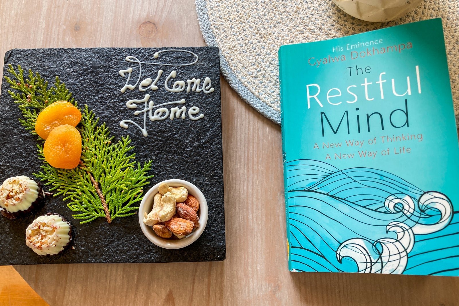 a plate with small snacks sits next to a booked called The Restful Mind